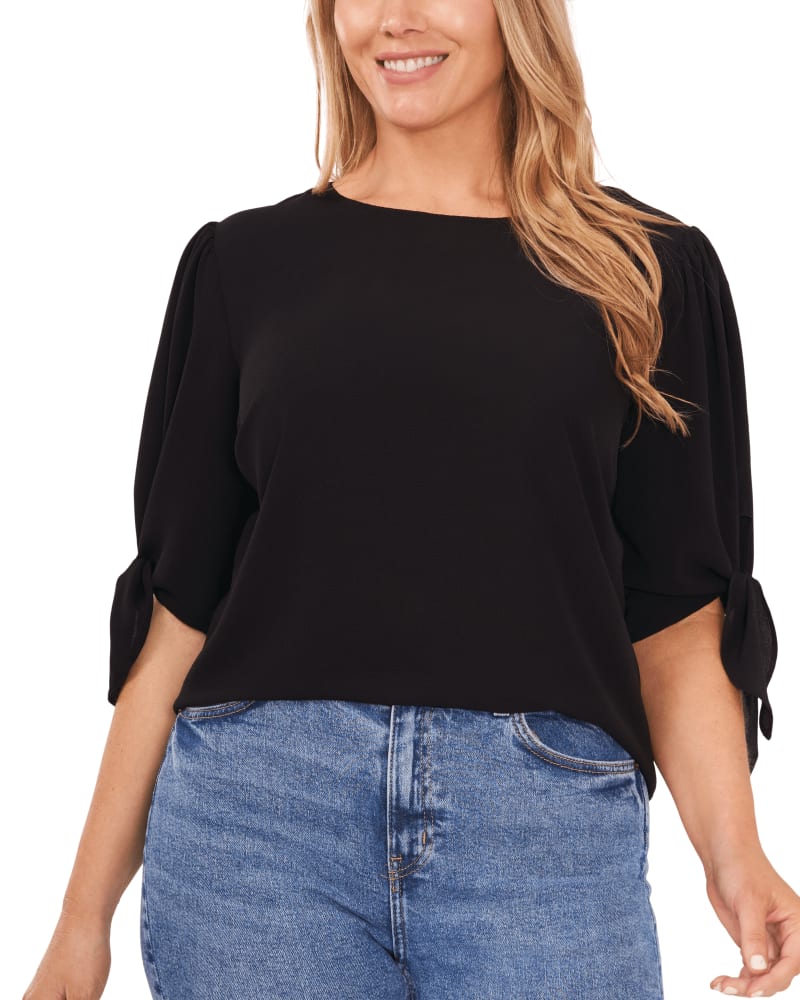 Front of a model wearing a size 1X Brielle Puff Sleeve Blouse in RICH BLACK by CeCe. | dia_product_style_image_id:263341